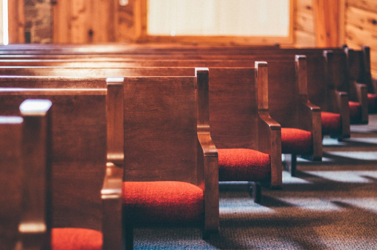 The sanctuary Aspire's work is built to serve — rows of pews waiting for a congregation