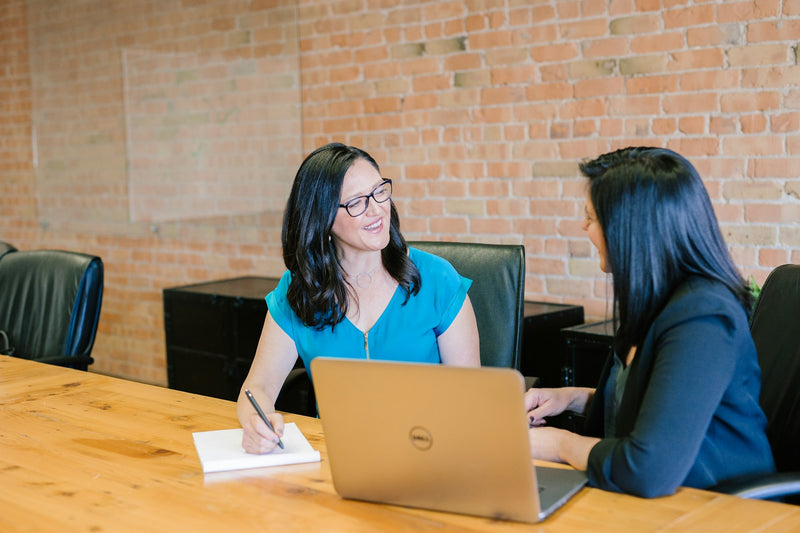A facilitated conversation between team members in a bright meeting room